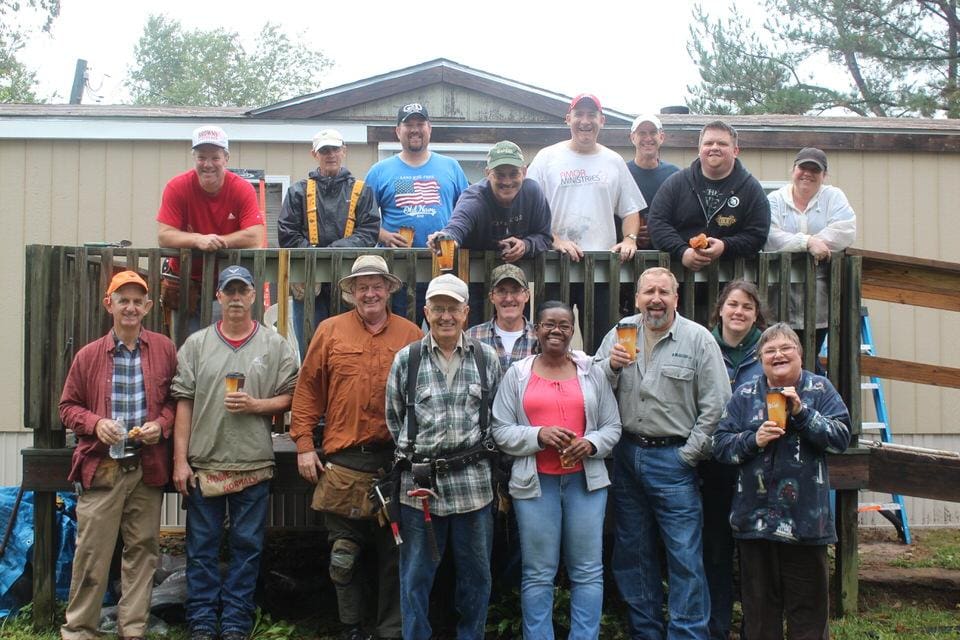 A group of people standing next to each other.